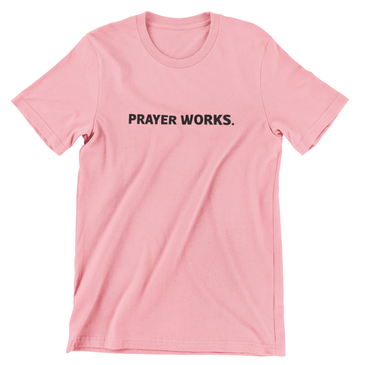 "Prayer Works." Desert Pink t-shirt with black print; unisex